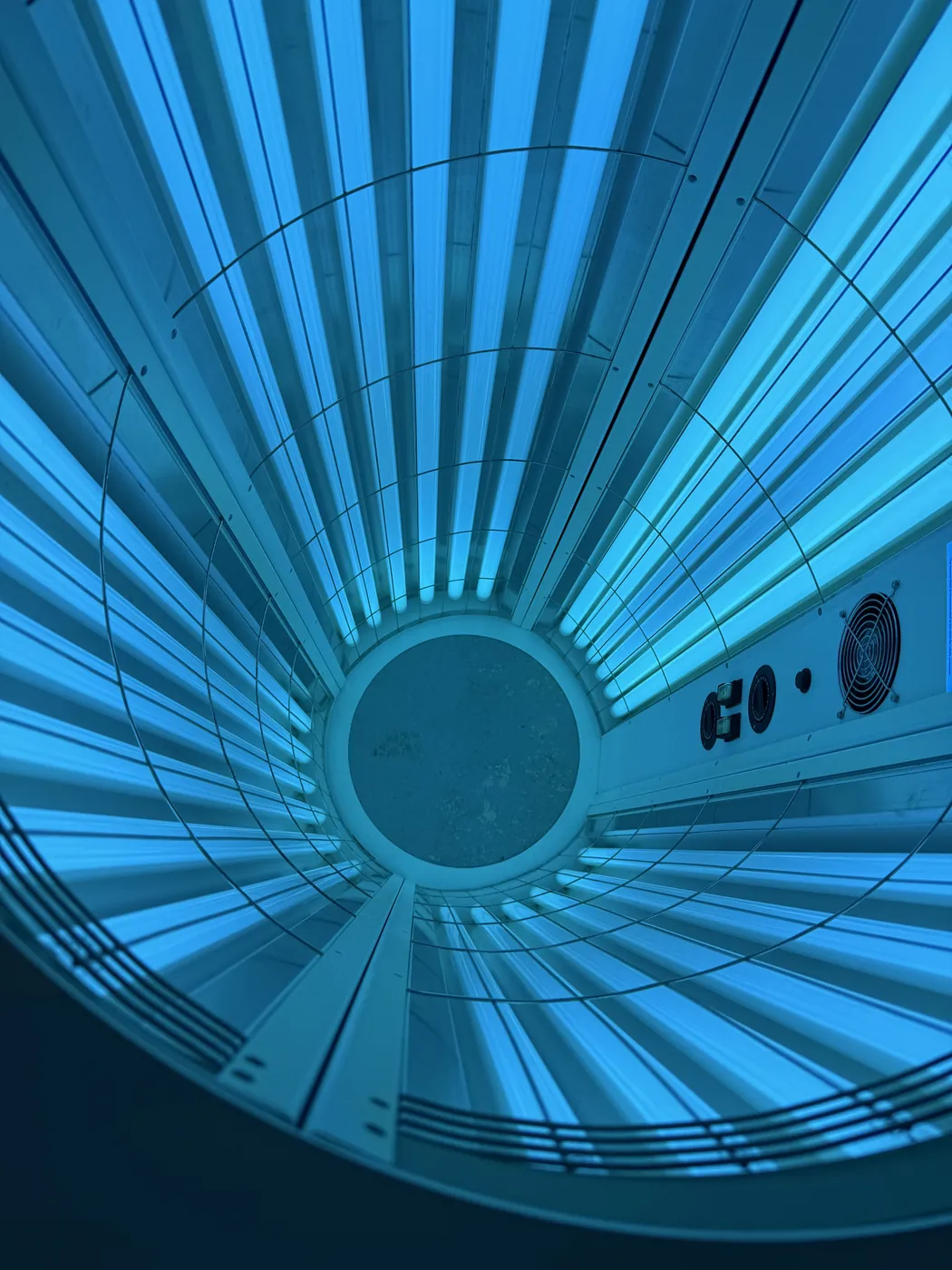 Looking up inside the Sapphire Sunshower at the lit tube array and fans